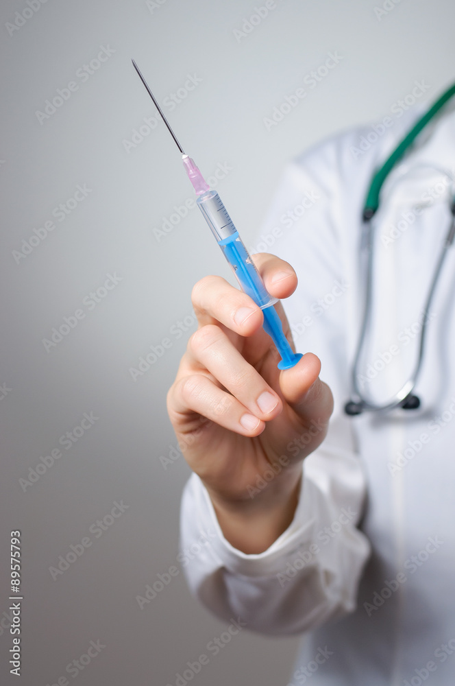 Female doctor with syringe Female doctor with syringe