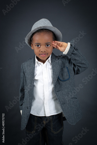 Handsome boy doing different expressions in different sets of clothes: at attention