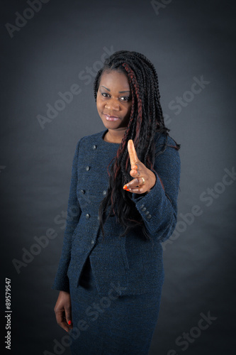 Beautiful woman doing different expressions in different sets of clothes: gun sign