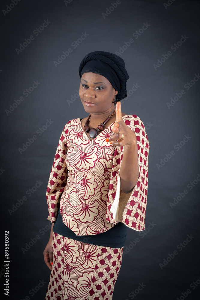 Beautiful woman doing different expressions in different sets of clothes: gun sign Beautiful woman doing different expressions in different sets of clothes: gun sign