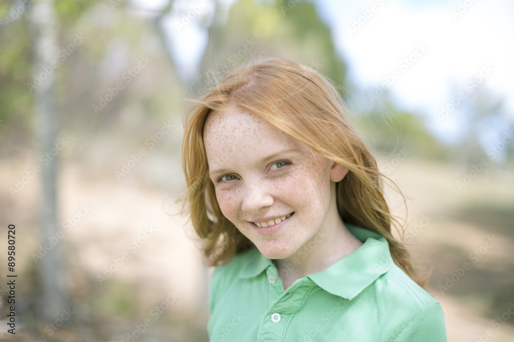Portrait of smiling girl with red hair and freckles Portrait of smiling girl with red hair and freckles