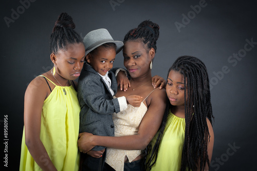 Beautiful family doing different expressions in different sets of clothes: sad © chris_b_paris