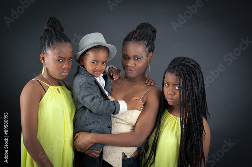 Beautiful family doing different expressions in different sets of clothes: angry