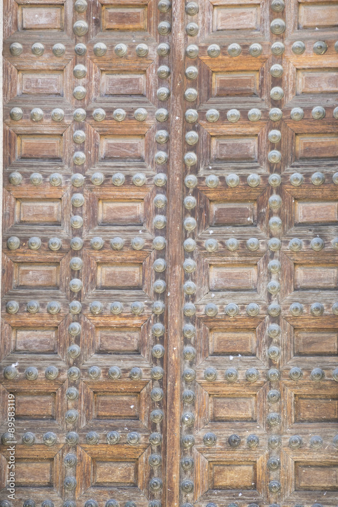 Exterior, old wooden door Castilian style in Toledo Spain Exterior, old wooden door Castilian style in Toledo Spain