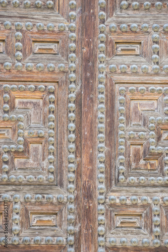 Vintage, old wooden door Castilian style in Toledo Spain
