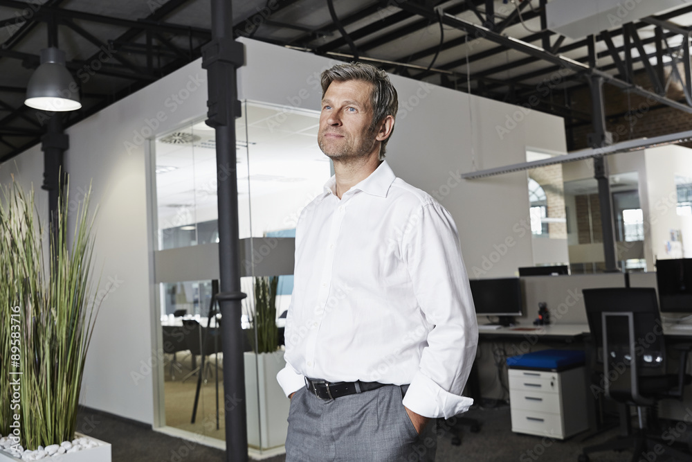 Businessman thinking in office Businessman thinking in office