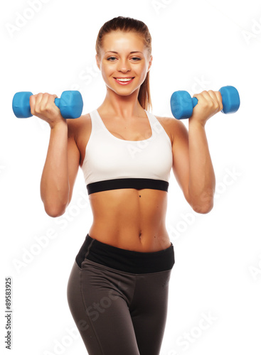 Woman in sport equipment practice with hand weights