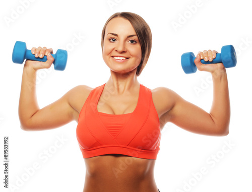 Woman in sport equipment practice with hand weights