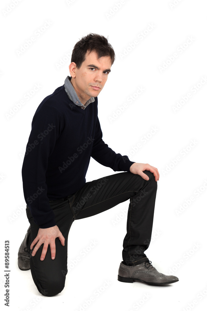 Handsome man doing different expressions in different sets of clothes: kneeling Handsome man doing different expressions in different sets of clothes: kneeling