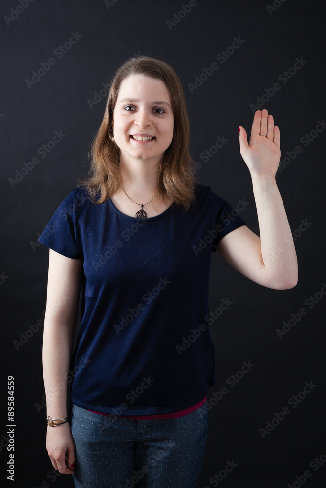 Beautiful woman doing different expressions in different sets of clothes: waving Beautiful woman doing different expressions in different sets of clothes: waving