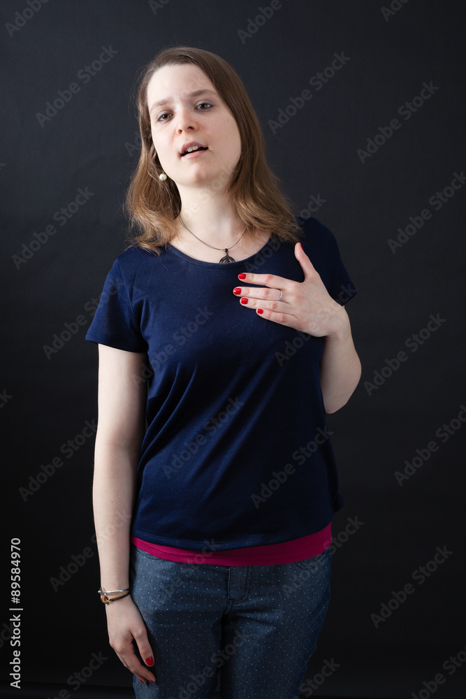 Beautiful woman doing different expressions in different sets of clothes: heart attack Beautiful woman doing different expressions in different sets of clothes: heart attack