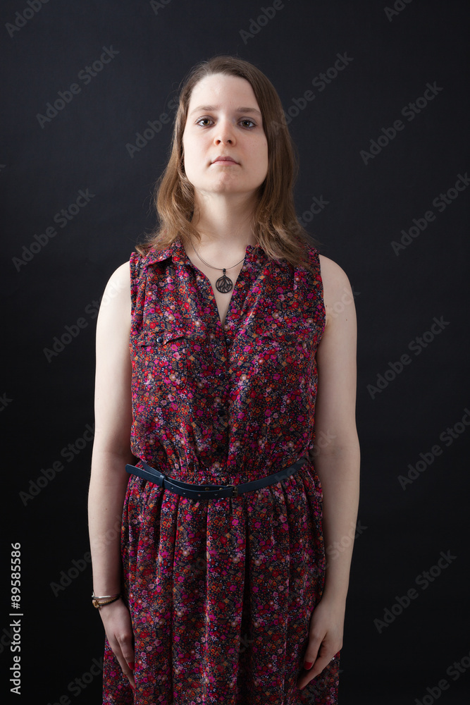 Beautiful woman doing different expressions in different sets of clothes: at attention Beautiful woman doing different expressions in different sets of clothes: at attention