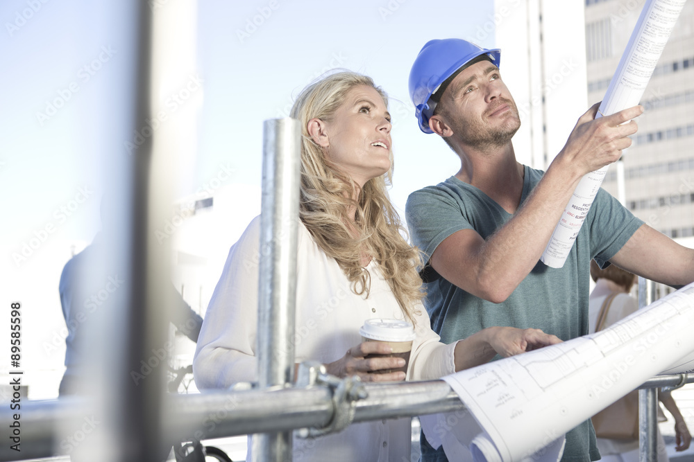 Foreman and architect discussing on construction site Foreman and architect discussing on construction site