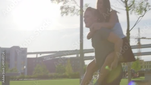 Cute teens have piggyback ride fun photo