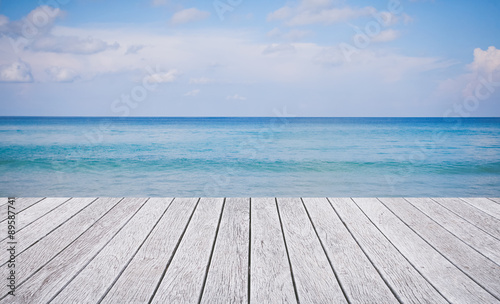 Wooden floor with beautiful ocean and blue sky
