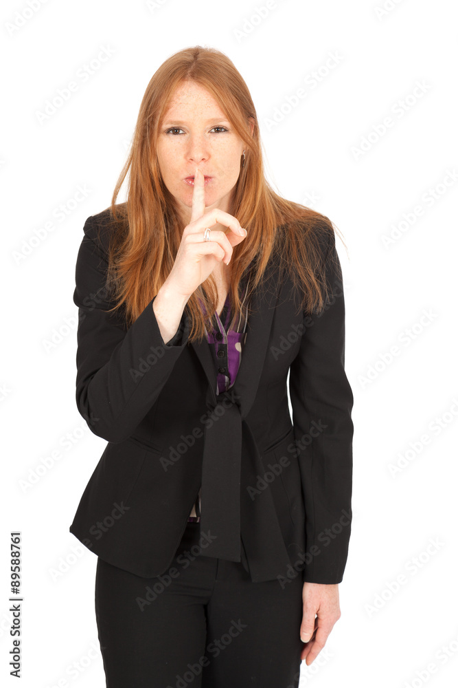 Beautiful businesswoman doing different expressions in different sets of clothes: be quiet Beautiful businesswoman doing different expressions in different sets of clothes: be quiet