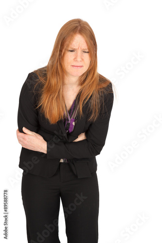 Beautiful businesswoman doing different expressions in different sets of clothes: stomachache