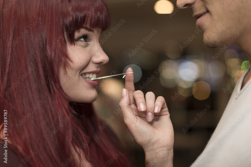 Young woman flirting in a bar, close-up Young woman flirting in a bar, close-up