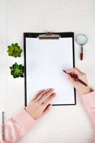 Hands working in the office with documents  on white table