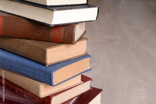Heap of old books on wooden background