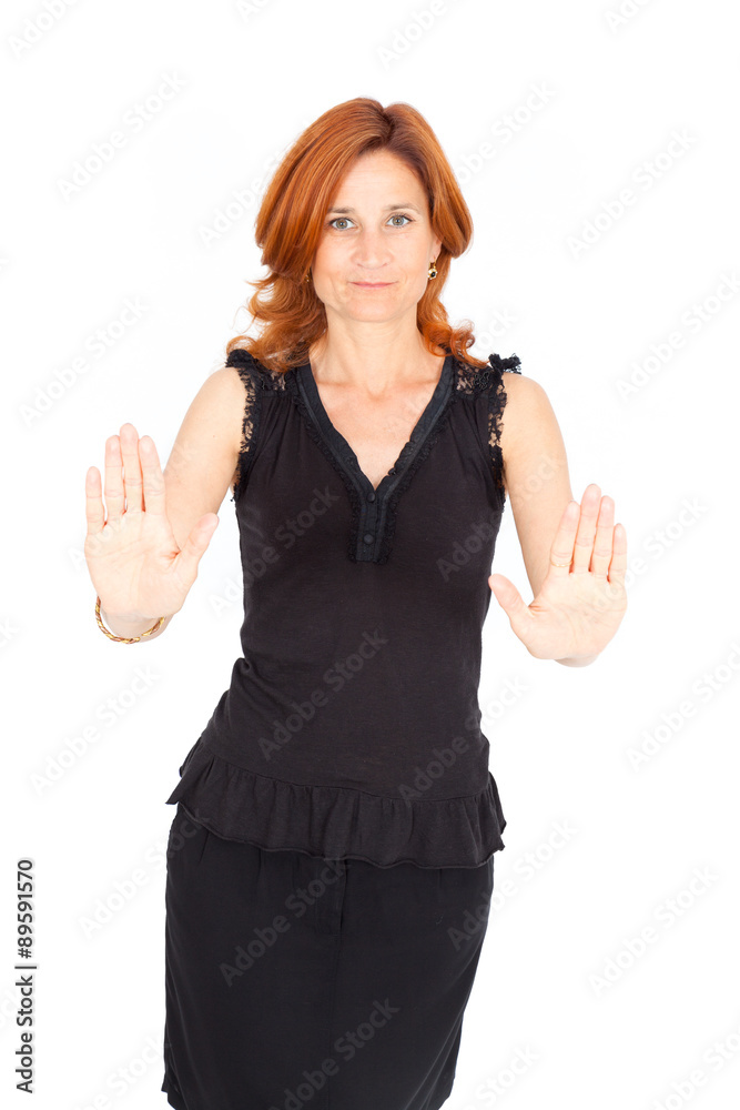 Beautiful businesswoman doing different expressions in different sets of clothes: stop sign Beautiful businesswoman doing different expressions in different sets of clothes: stop sign