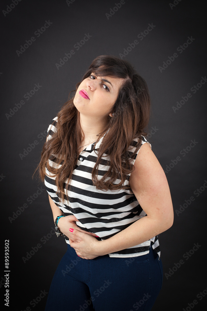 Beautiful woman doing different expressions in different sets of clothes: stomachache Beautiful woman doing different expressions in different sets of clothes: stomachache