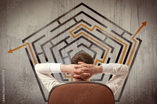 Fotografie Businessman looking at a maze