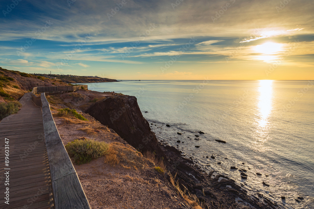 Pathway along the coast at sunset