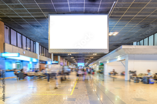 TV screen advertising at airport terminal.
