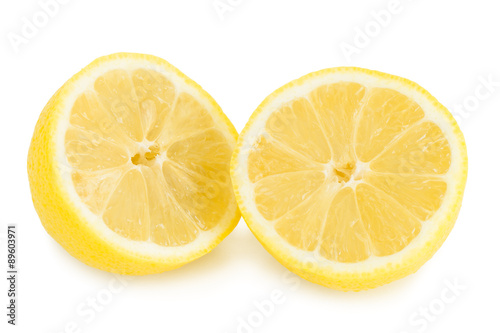 Close-up of a ripe lemon cut in half  isolated on white background.