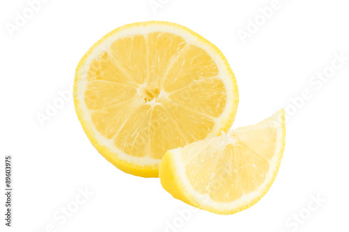 Close-up of half and quarter slices of lemon  isolated on white background.