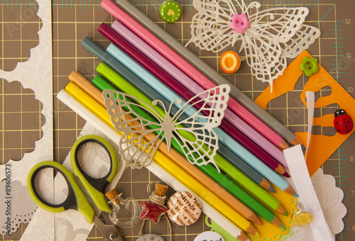 Scrapbooking and art background with tools, elements, colored pe