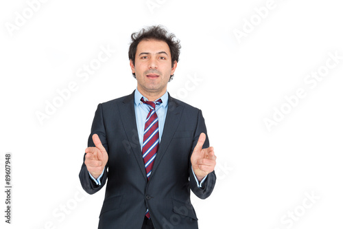 Handsome arabic man doing different expressions in different sets of clothes: gu, sign