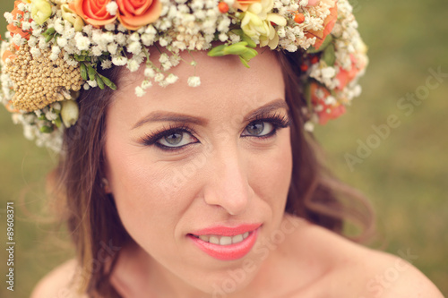 Beautiful bride wearing make up and a floral crown