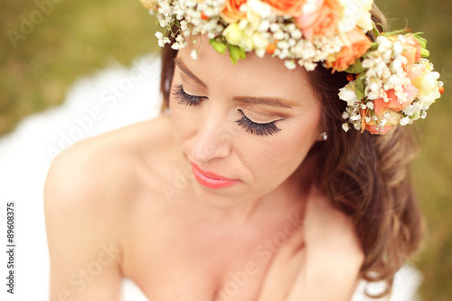 Beautiful bride wearing make up and a floral crown