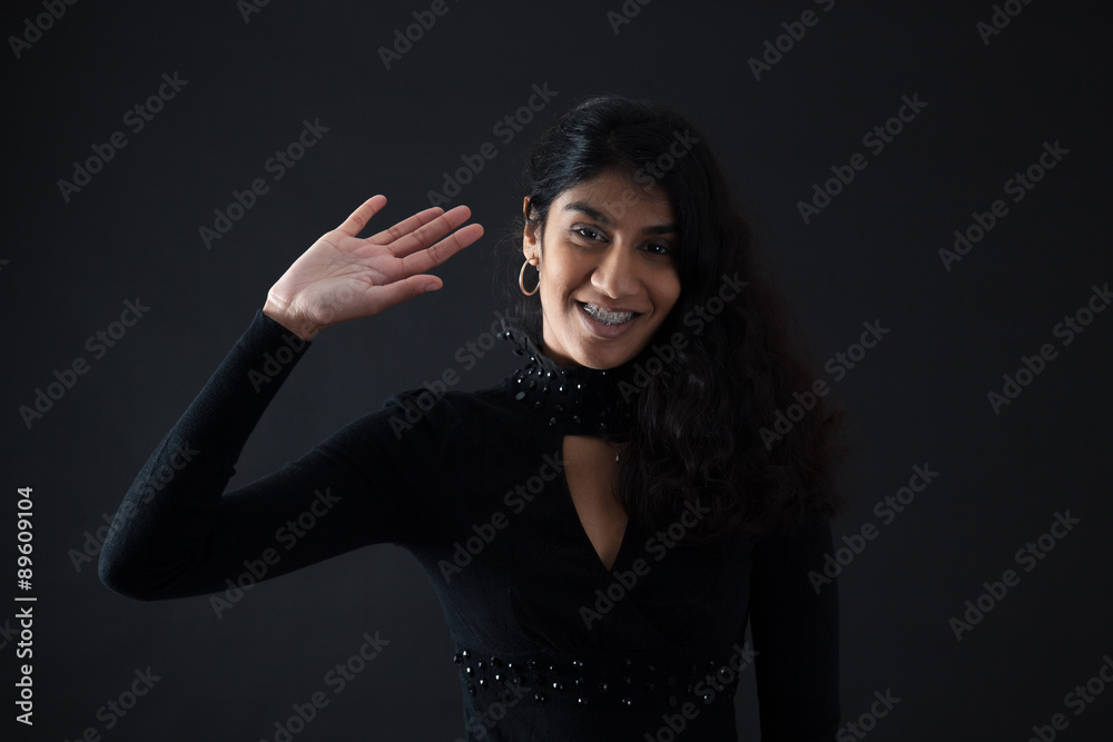 Beautiful woman doing different expressions in different sets of clothes: waving Beautiful woman doing different expressions in different sets of clothes: waving