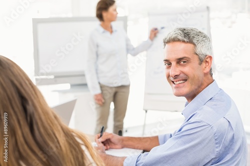 Smiling businessman during a meeting