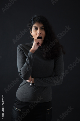 Beautiful woman doing different expressions in different sets of clothes: yawn