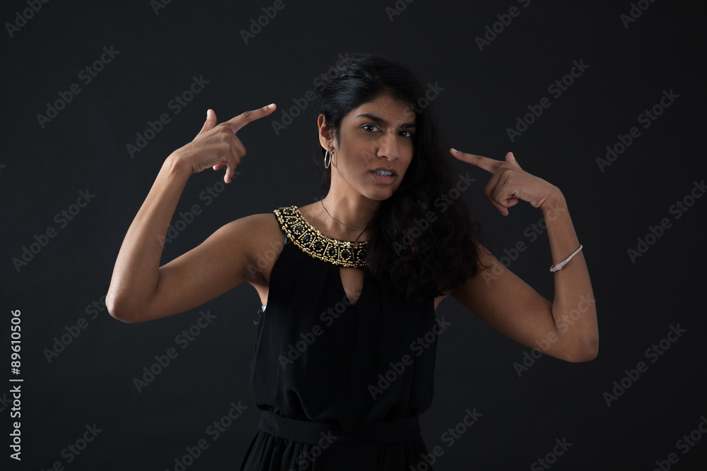 Obraz premium Beautiful woman doing different expressions in different sets of clothes: you are crazy