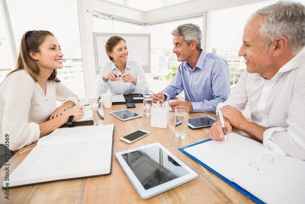 Smiling business people having a meeting Smiling business people having a meeting