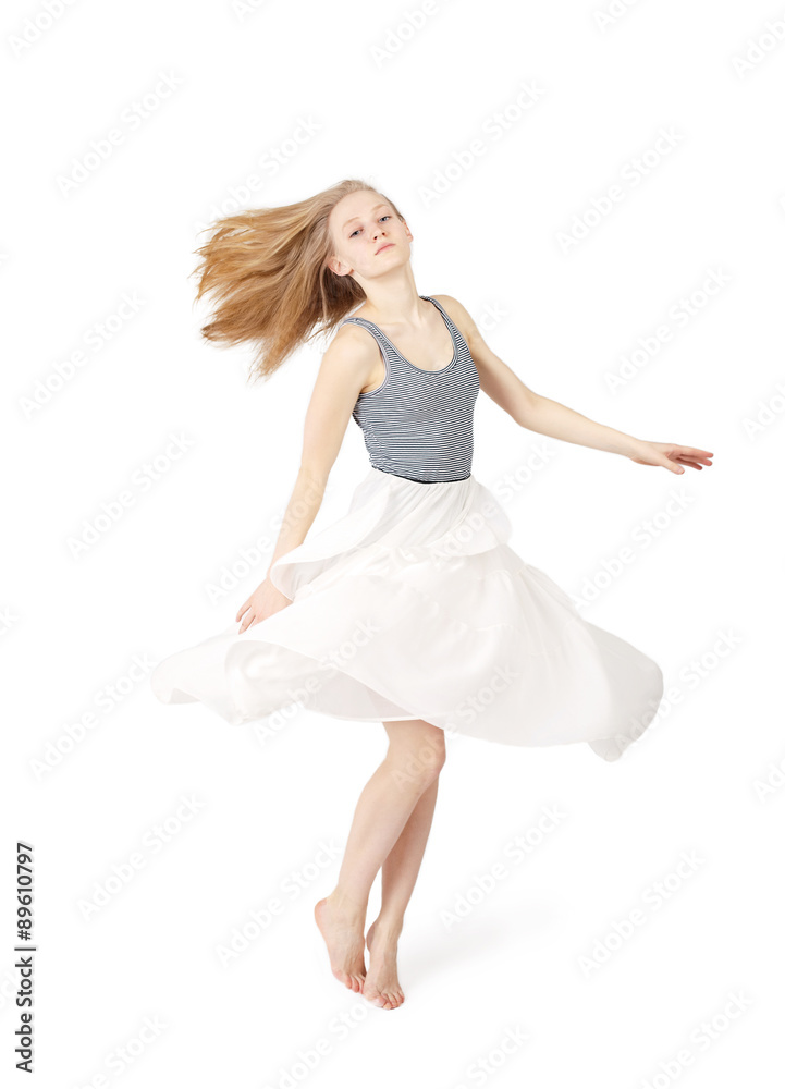 Young blond woman in skirt  dancing with long hair on white background isolated