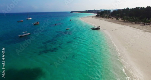 Aerial view Flying camera over Sea Beach. Africa. Tanzania. Zanzibar. Travel tourism adventure in wild nature camera bird eye view.