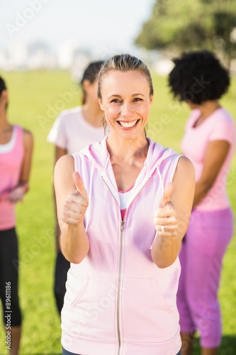 Smiling blonde wearing pink for breast cancer 