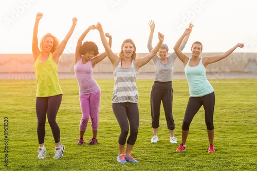 Happy sporty women dancing during fitness class