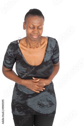 Beautiful black woman doing different expressions in different sets of clothes: stomachache