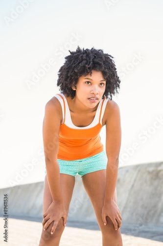 Breathing young sporty woman resting 