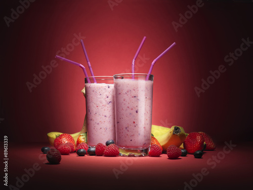 Moody fruit smooties with fruit served in glasses
