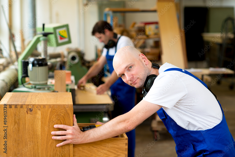two worker in a carpenter's workshop two worker in a carpenter's workshop