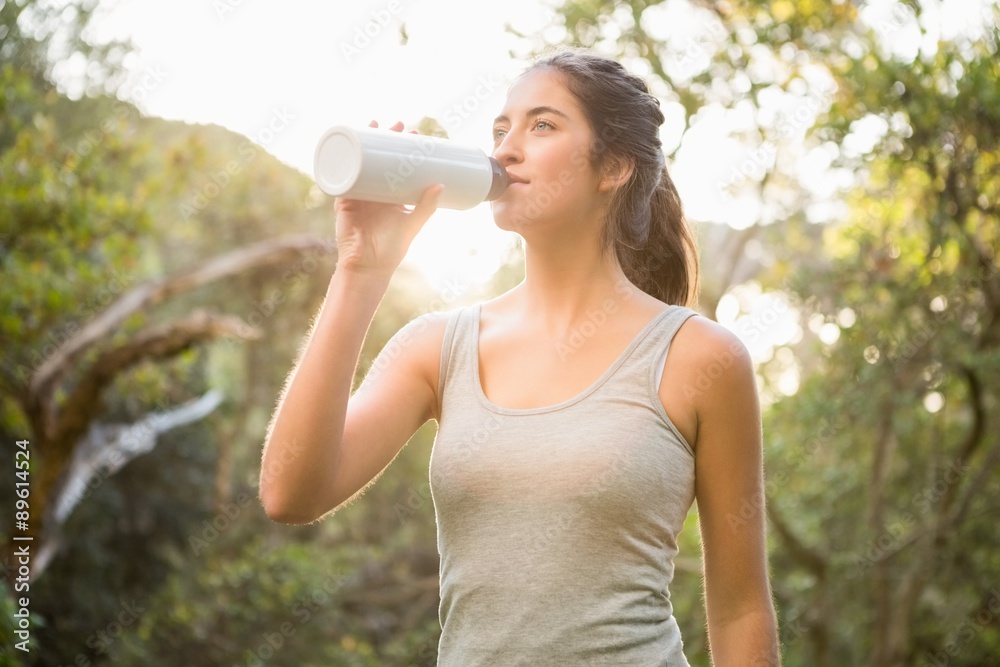 Pretty athletic brunette drinking out of bottle Pretty athletic brunette drinking out of bottle