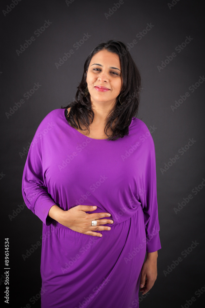 Obraz premium Beautiful woman doing different expressions in different sets of clothes: hungry